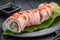 Sushi roll dragon with tuna and spicy sauce