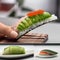 A sushi roll shaped like a jellyfish, with translucent avocado tentacles2