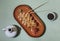 Sushi roll with soy sauce and chopsticks on a wooden stand on a bright yellow-blue background. Sushi menu.