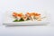 Sushi roll with tuna, Philadelphia cheese, flying fish caviar, bell pepper