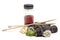 Sushi rolls cucumber japanese food with chopsticks and soy sauce isolated on white