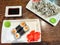 Sushi rolls with fresh ingredients served on a platter. Japanese Sushi Rolls on White Plate With Ginger Garnish. Blurred