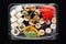 Sushi rolls mix in a plastic box container