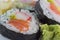 Sushi rolls with seaweed and chopsticks and wasabi