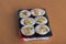 Sushi rolls on the yellow table.