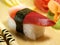 Sushi with sea bass on a wooden tray close-up