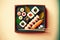 Sushi set of assorted sashimi rolls and sushi with sticks on tray