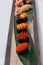 Sushi Set Include Tobiko, Ikura, Sea Urchin and Ikura, Urchin and Quail Egg Yolk Served on Leaf on Stone Plate