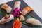 Sushi Set Include Torched Salmon, Engawa, Hotate, Hamachi, Tai and Ikura with Hirame Served with Wasabi and Prickled Ginger.