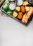 Sushi set with nigiri, tamago egg , ama ebi raw prawn and uni ikura on gray stone background, top view