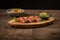 Sushi set. Rolls with salmon, eel and red caviar on a wooden plate. Restaurant