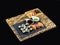 Sushi Set on Slate an Bamboo plate with Sushi Rolls and Wasabi on Black Background