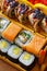 Sushi sets of different types of sushi are cured for serving in a restaurant. Delicious Japanese cuisine.