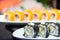 Sushi of shrimp and avocado and caviar with orange sushi