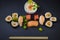 Sushi on a stone platter.