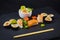 Sushi on a stone platter.