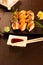 Sushi and sushi roll set on a black stone table