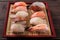 Sushi various assortment red bamboo tray japanese food