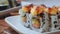 Sushi on white plate close-up, macro avocado, cream cheese, sesame. Japan restaurant menu