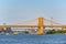 Suspended Brooklyn Bridge across Lower Manhattan and Brooklyn. N
