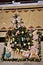 A suspended Christmas decoration with Christmas tree and rabbits and gifts