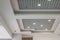 Suspended and grid ceiling with halogen spots lamps and drywall construction in empty room in store or house. Stretch ceiling