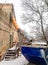 Suspended sections of black garbage chute on a facade of old building under construction in winter day, Debris Chutes. Dumpster