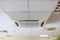 Suspended tile ceiling with high-capacity air conditioner unit, an office room