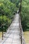 Suspended wooden bridge across Schodnica river