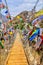 Suspension bridge with colourful prayer flags in Bhutan