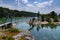 Suspension bridge connecting small islands on a coastal archipelago with lagoons and forests on the Baltic Sea coast