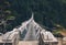 Suspension Bridge decorated with multicolored Tibetan Prayer flags hinged over gorge. Everest Base Camp EBC trekking route,