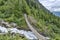 Suspension bridge over fast mountain river