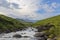 Suspension bridge over mountain stream