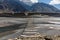 Suspension bridge passu cones mountain range rocky scenery