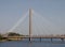 Suspension bridge and pier crossing the lake in kings gardens southport merseyside with swans in the water