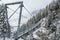 Suspension bridge in winter haze, Burgstein, Solden, Austria