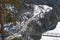 Suspension footbridge at mountain pass in winter landscape