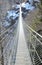 Suspension metal bridge with steel ropes also called Tibetan typ