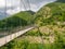 Suspension pedestrian bridge over Vagli Lake near Vagli di Sotto village in Lucca province, Italy, with no identifiable