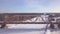Suspension railway bridge for train movement over winter river aerial view. Winter train bridge through frozen river