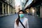 Suspicious young adult affected by the COVID-19.Walking,going to work during pandemic.Protective measures,mask wearing.Respecting