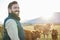 Sustainability, cows and portrait of farmer with smile on field, happy farm in countryside with dairy and beef