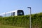 Sustainable driverless modern light rail metro train on railroad track in Europe