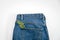 Sustainable fashion, Circular economy, denim eco friendly clothing. Green leaf plant on blue denim jeans background