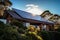 Sustainable Modern Living: Solar Panels Grace Gable Roof in Sunlit Brilliance