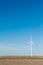 Sustainable wind energy generators against blue sky; renewable e