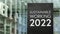 Sustainable Working 2022 sign in front of a modern office building