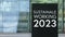 Sustainable Working 2023 on a sign outside a modern office building