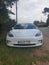 Sutton Suffolk UK August 12 2021: A 2019 model Tesla Model 3 Long-Range Dual Motor AWD electric vehicle parked in a small